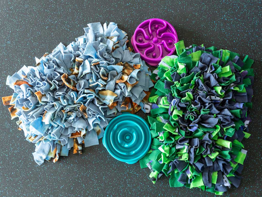 A selection of snuffle mats and slow feeder bowls for dogs
