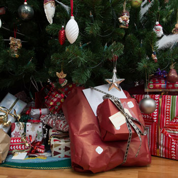 Christmas presents under a Christmas tree